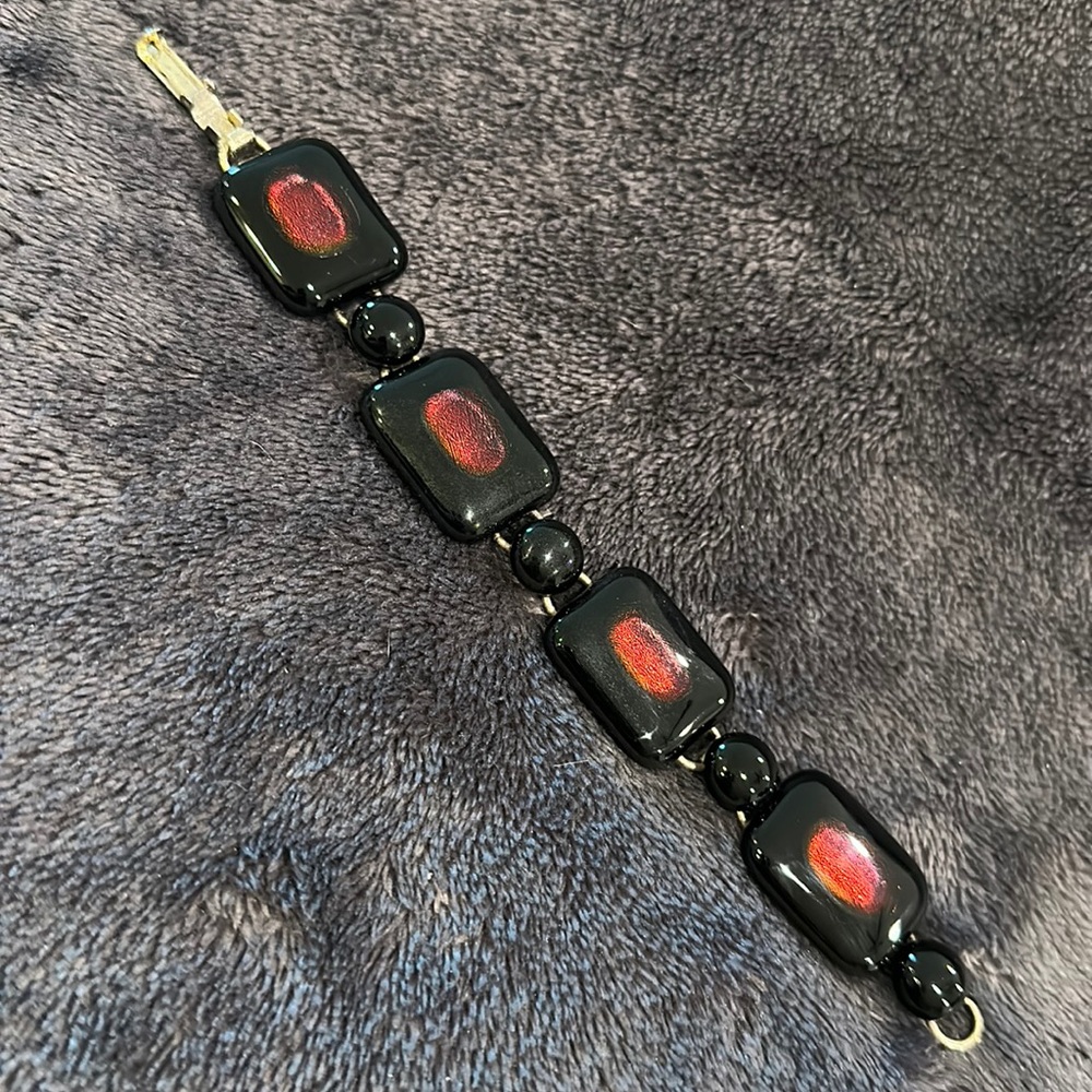 Black and dichroic red glass bracelet
